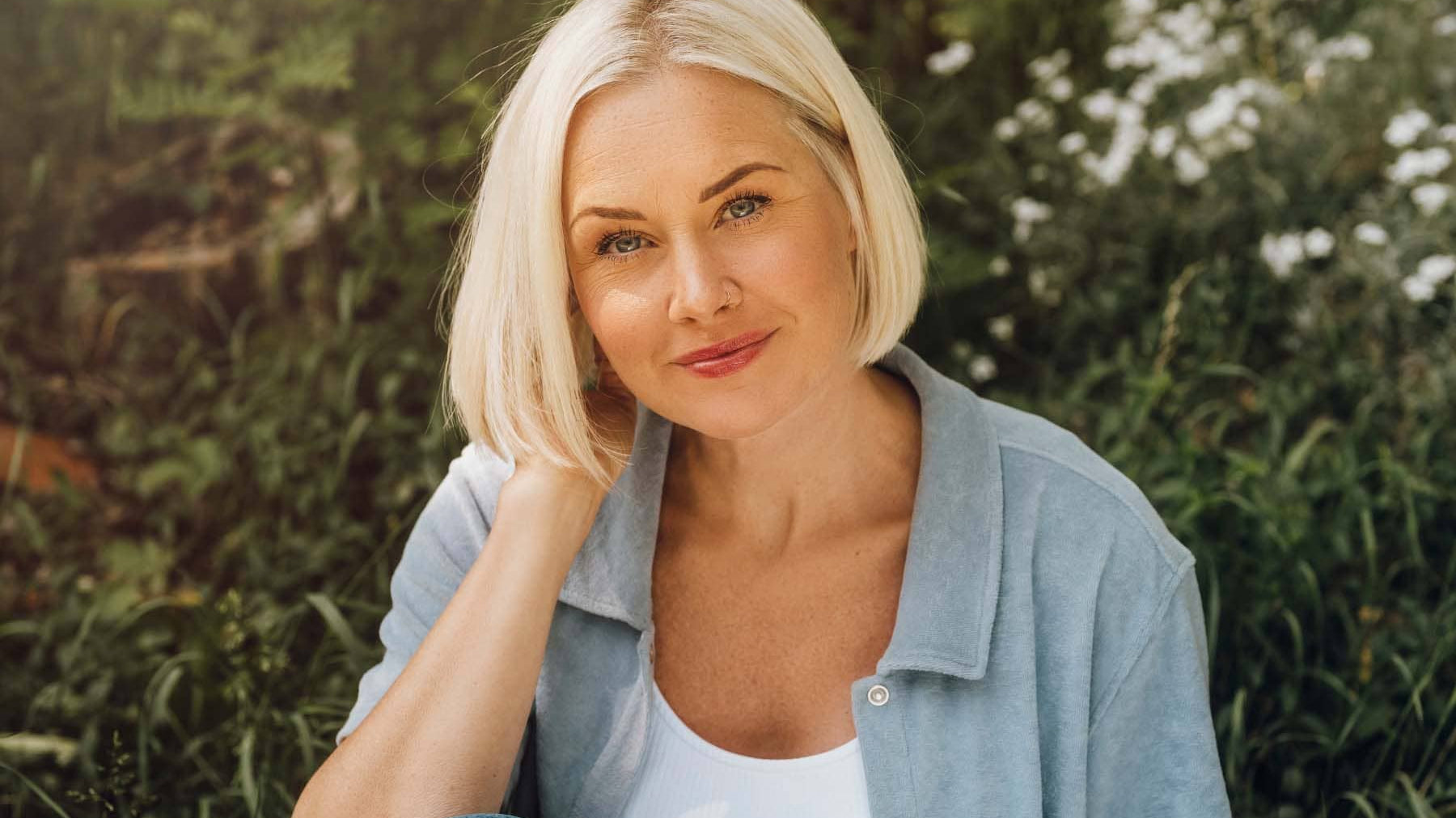 woman protecting blond hair from sun and heat damage