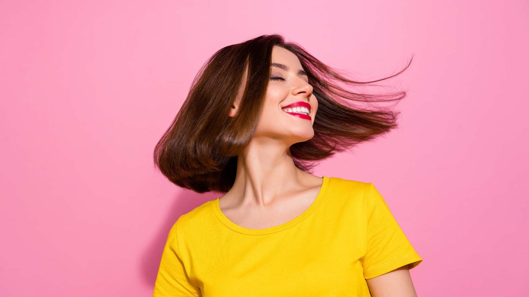 Woman with short hair flipping hair around