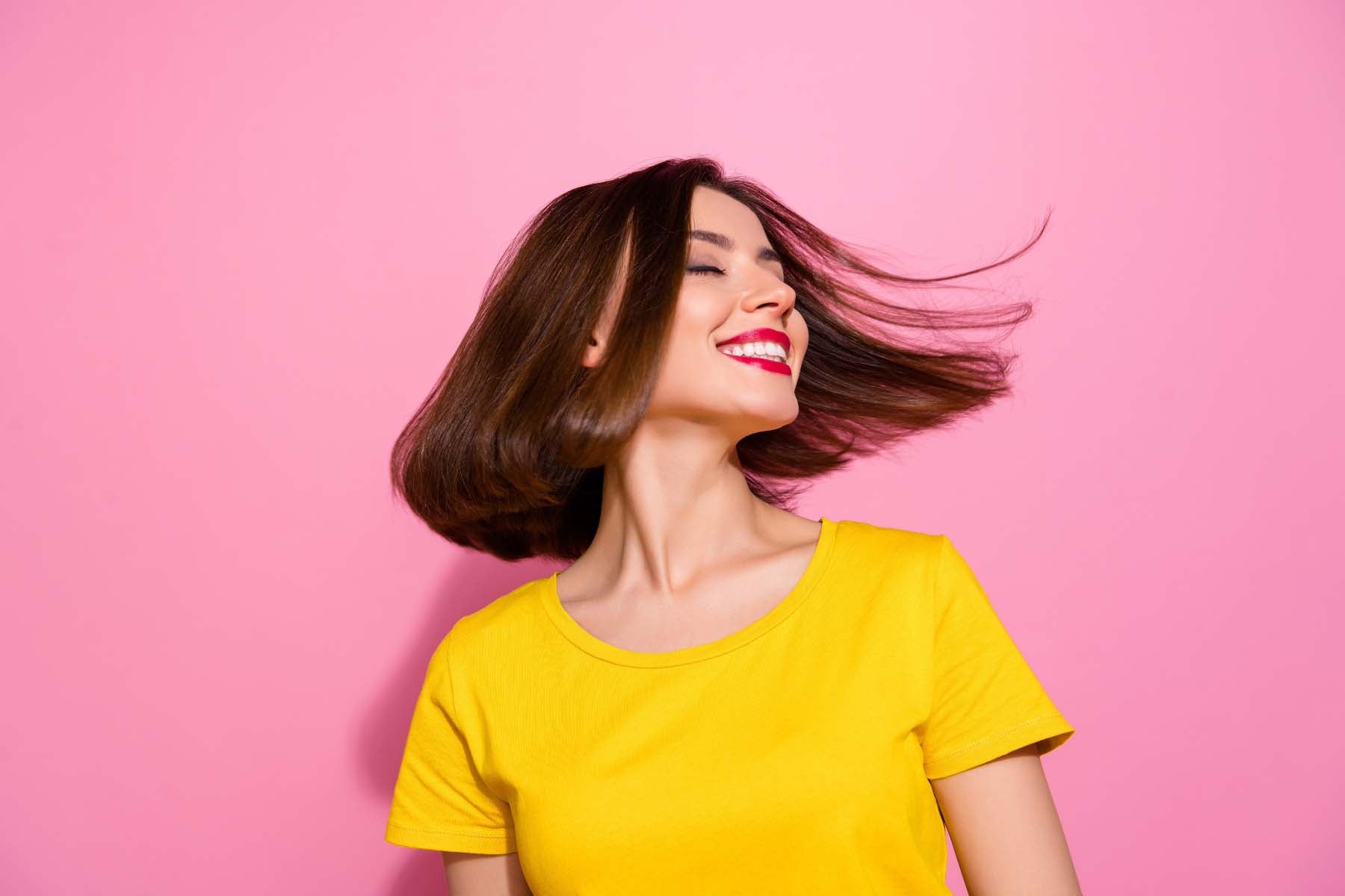 Woman with short hair flipping hair around